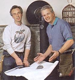 Dave and Herb Warren with building plans for the cabin.